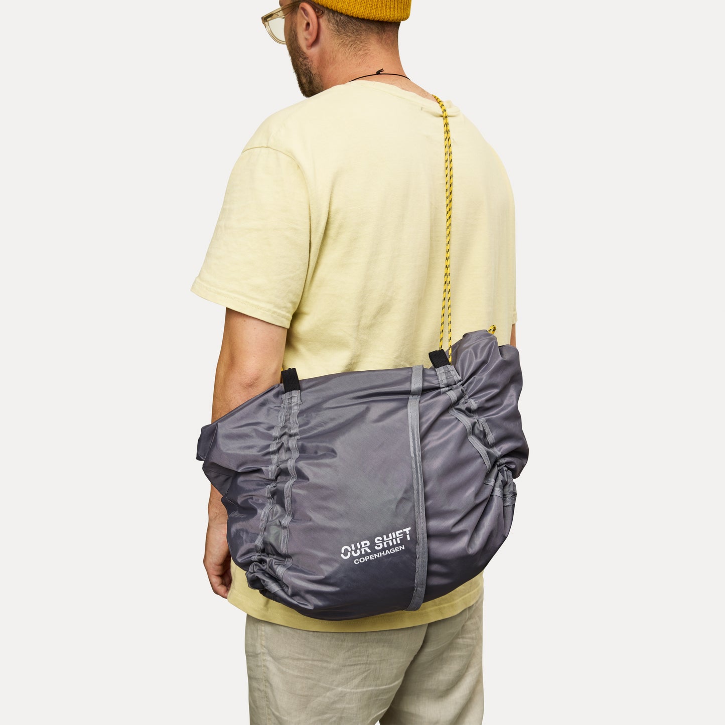 PRINTED DRAWSTRING SLING TOTE