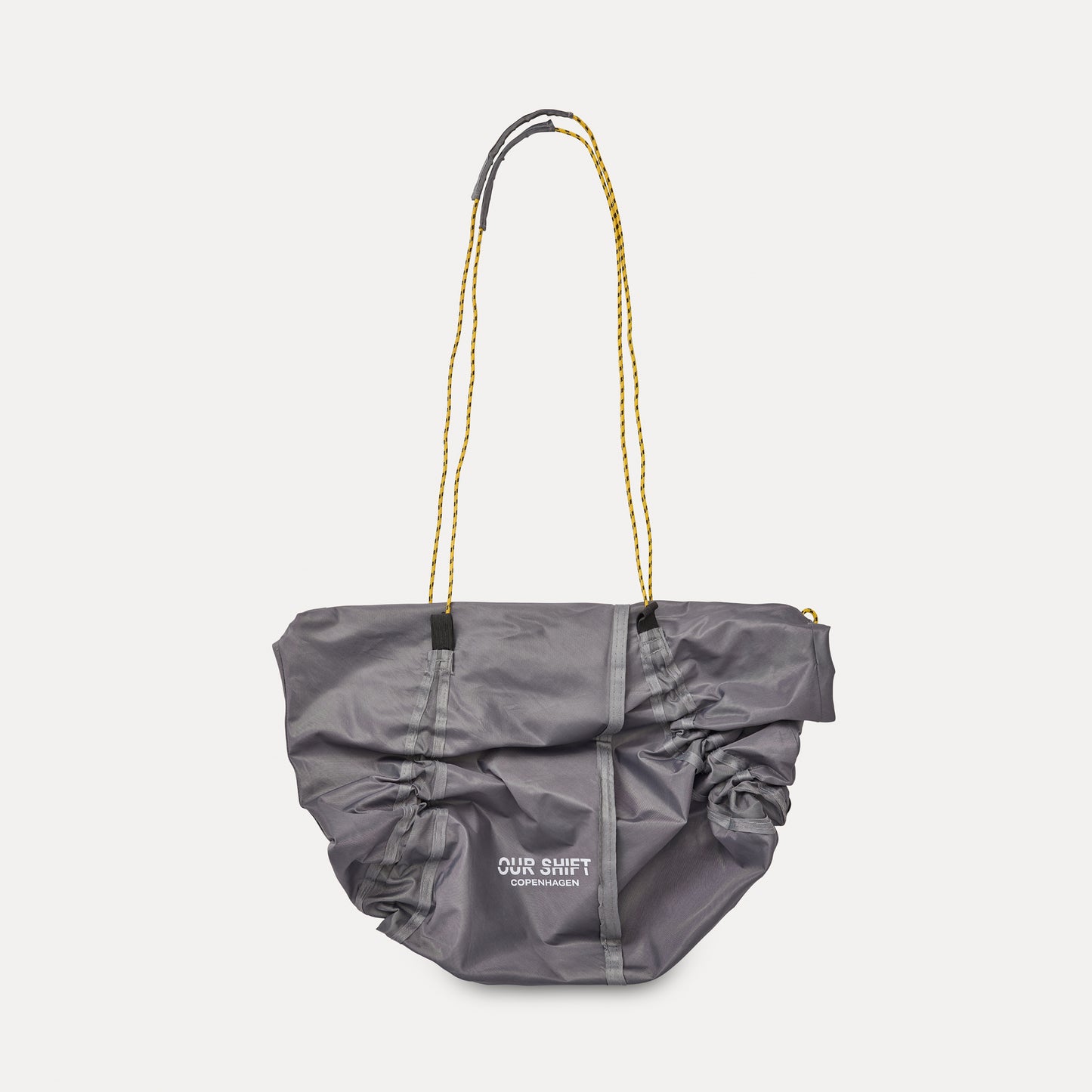PRINTED DRAWSTRING SLING TOTE