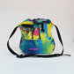 Upcycled tent cross-body bag with color splash details made from tents 