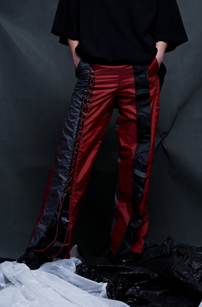 Blood red FESTIVAL-TENT TROUSERS with contrast and lace-up details